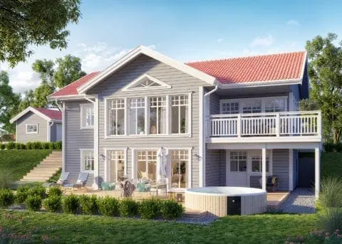 Sundvik ist ein besonders gut gelungenes Haus für die Hanglage. Das Wechselspiel von Holzpanelen und Putz wirkt interessant und lenkt den Blick auf die beiden großen Balkone.